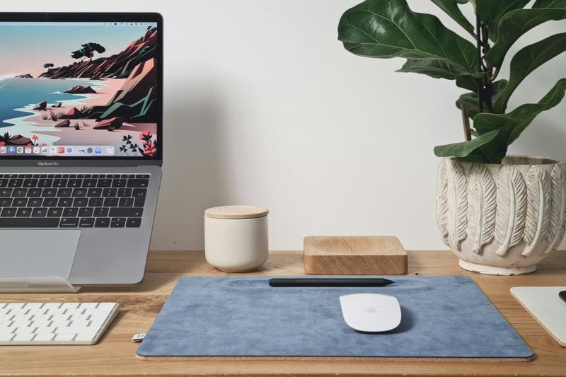 macbook pro on brown wooden table