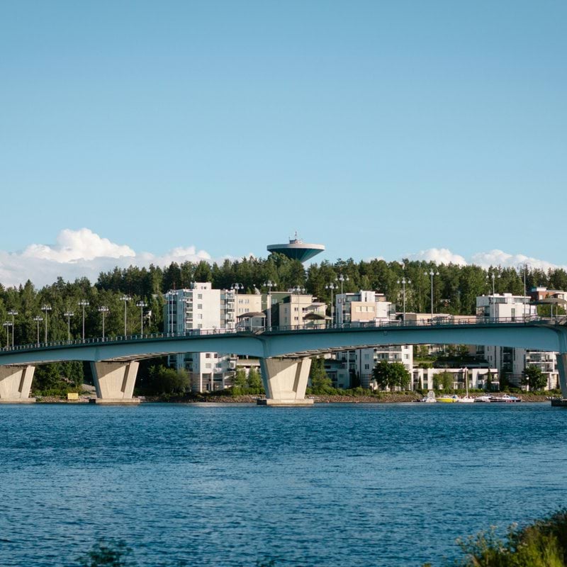 white bridge over blue sea under blue sky during daytime