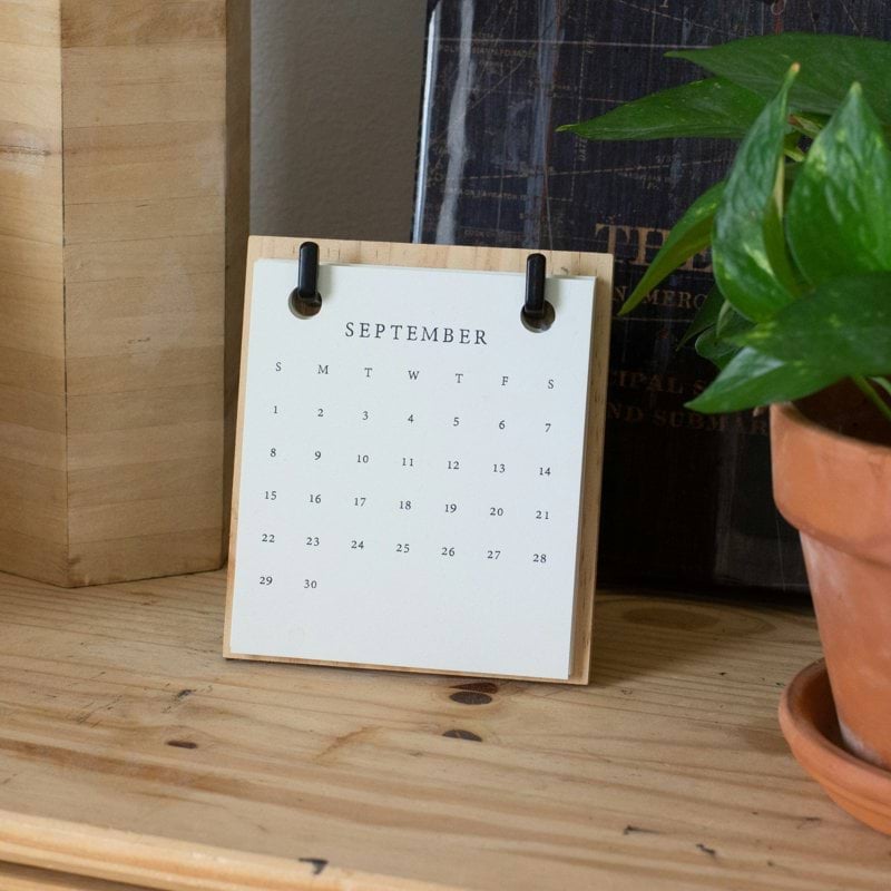 white braille paper on brown wooden table