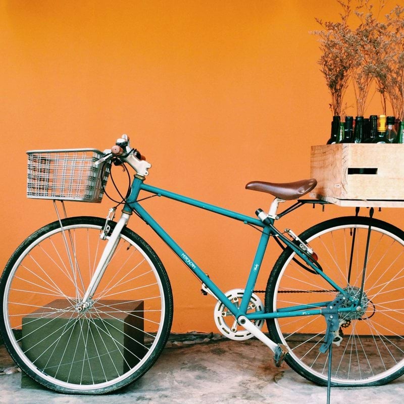 blue and black city bike on white flooring