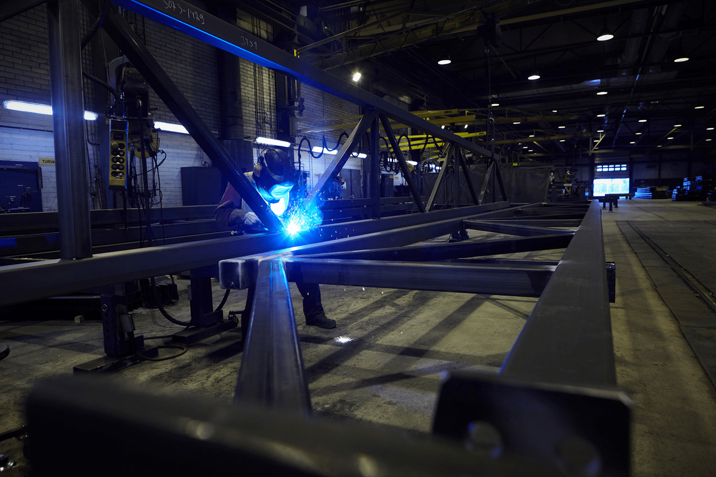 Welder working on a steel frame
