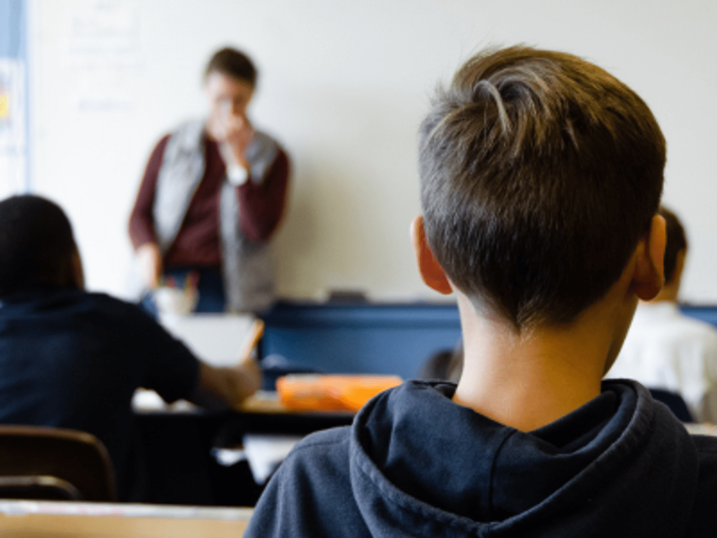 Young boy sat in a classroom