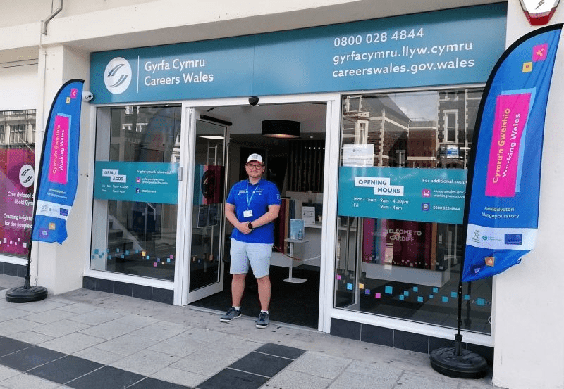 Employee standing outside a Careers Wales office