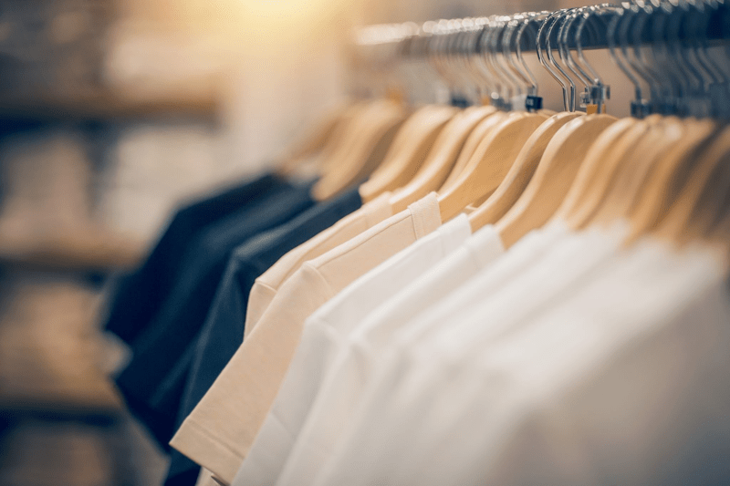 T-shirts hanging on hangers