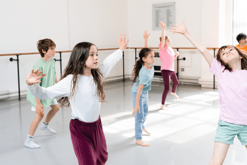 Group of children in a dance studio during a class.